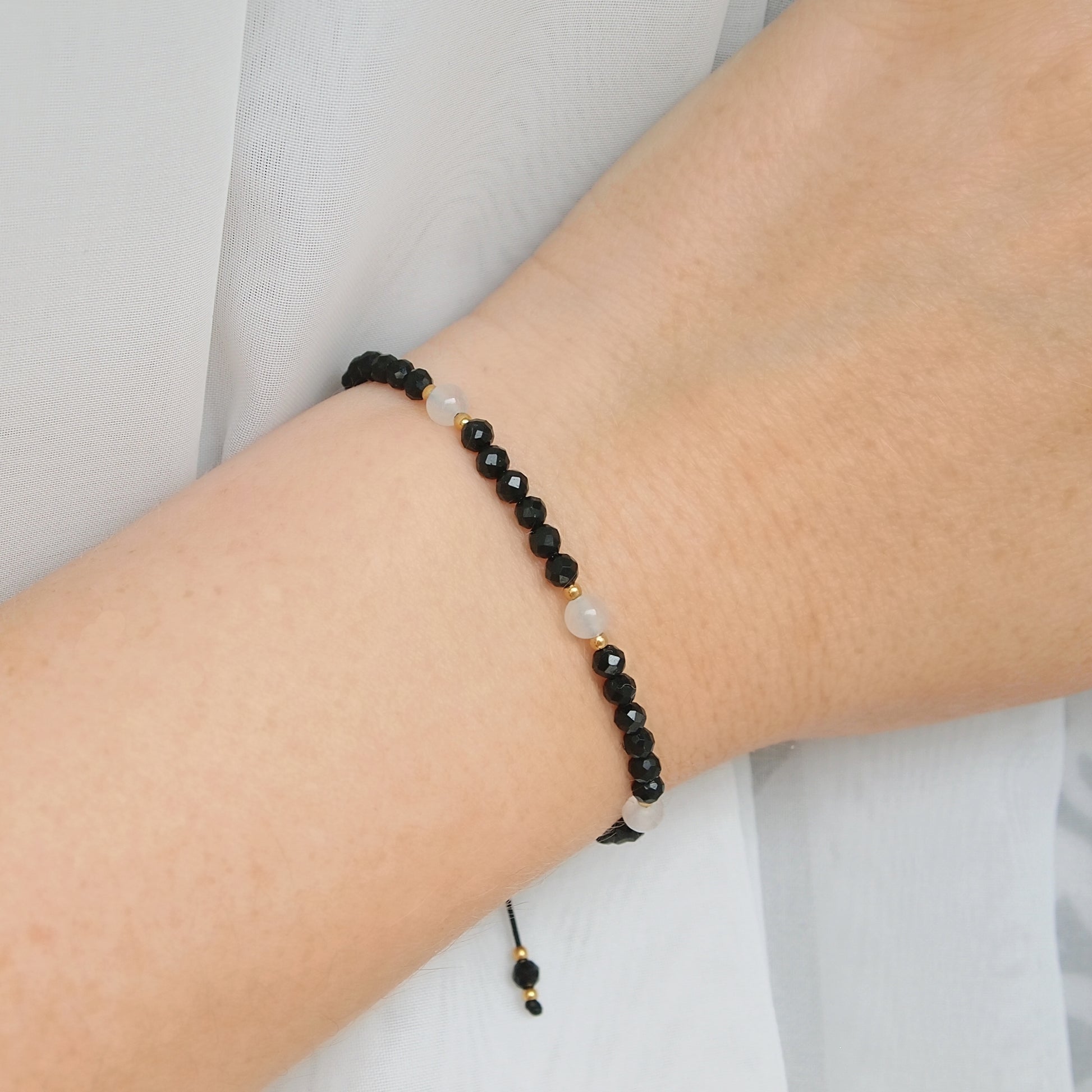 thin black tourmaline bracelet with selenite