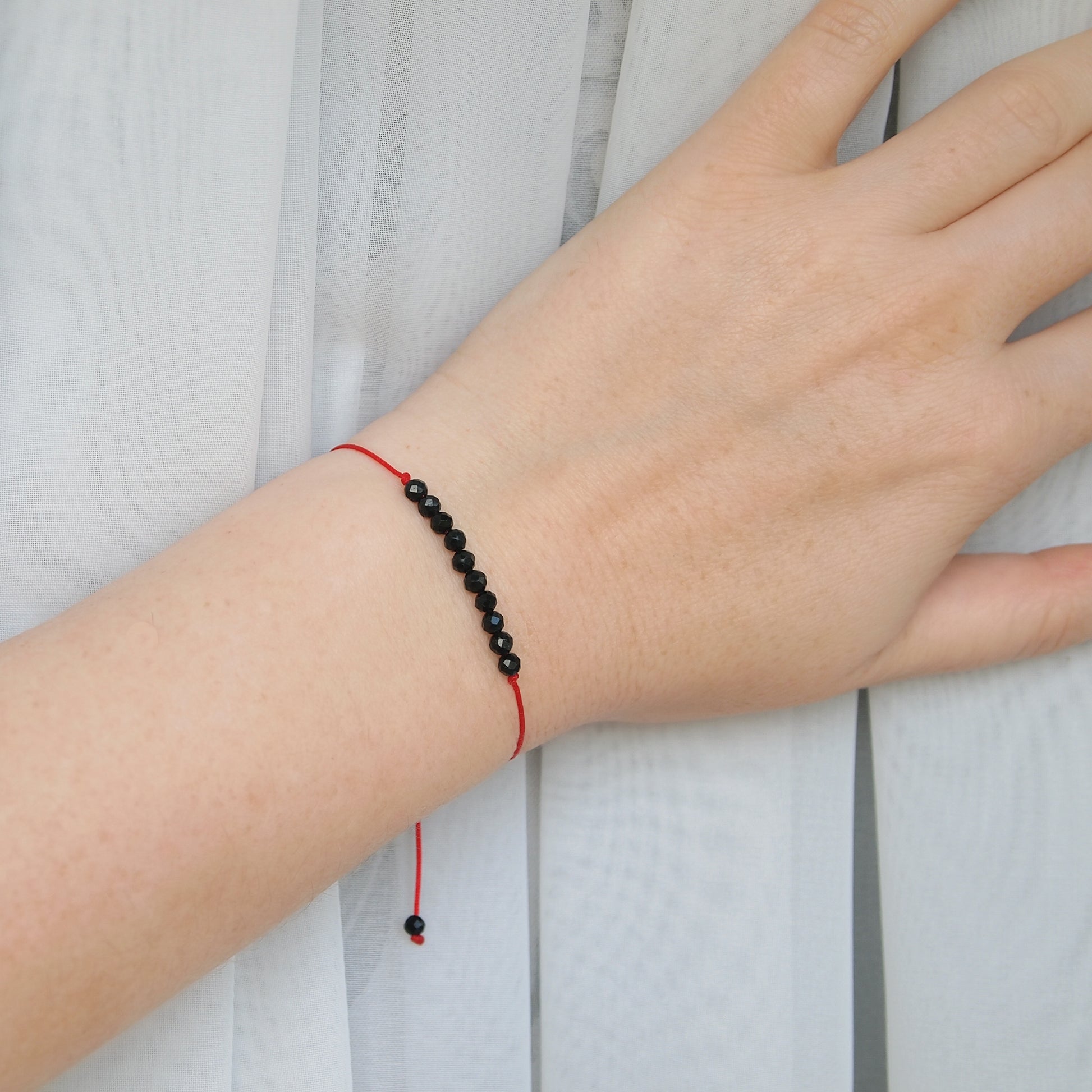 red thread protection bracelet with black tourmaline
